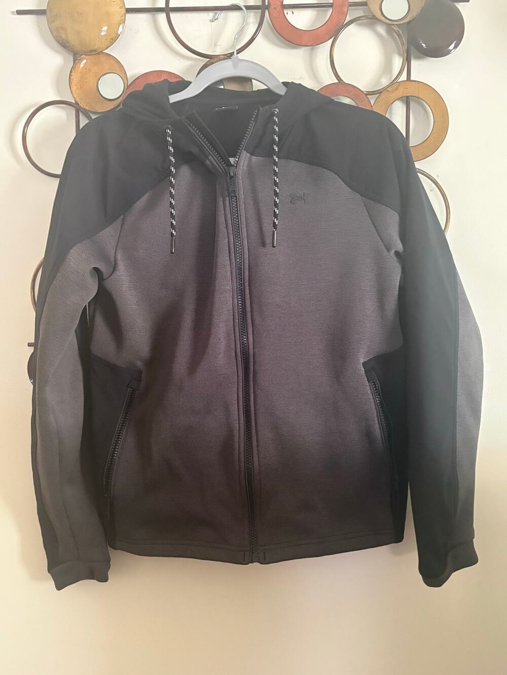 Women’s Under Armour Storm black and gray jacket with fleece lining size small.